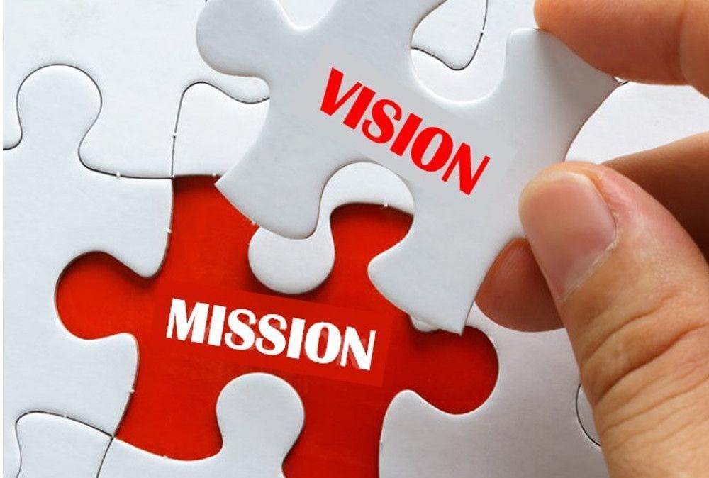 Puzzleteile mit Mission und Vision geschrieben