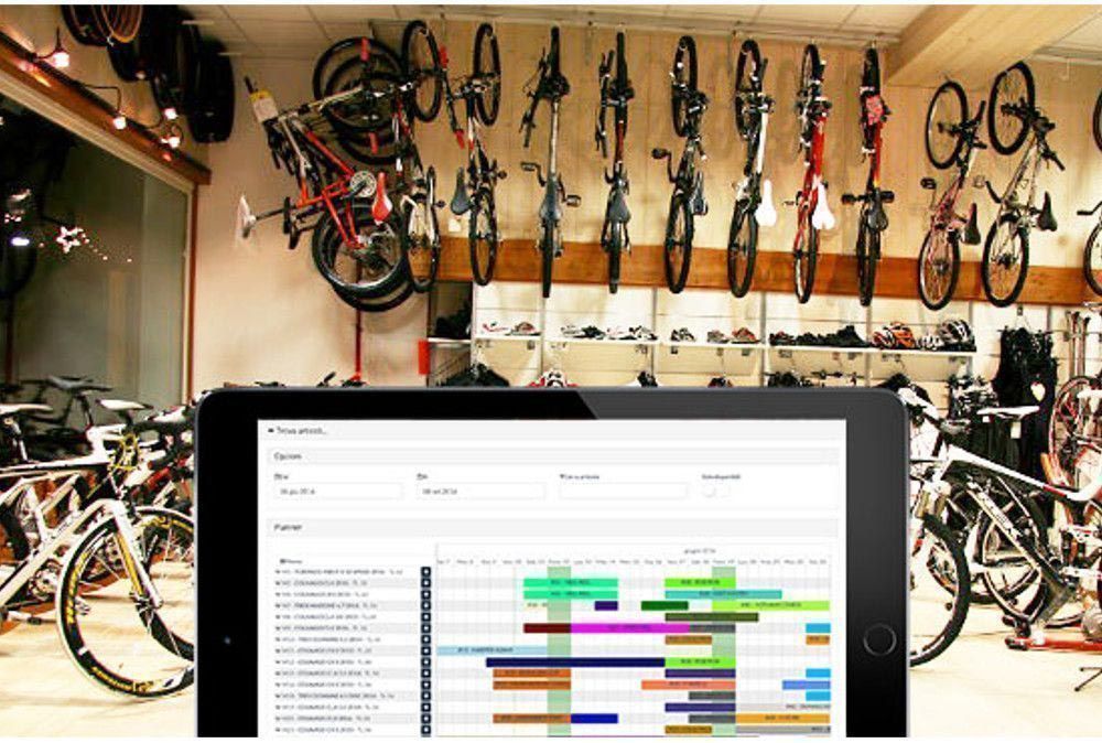 Bike rental with tablet in the foreground that has a RENT-ALL planner on the screen