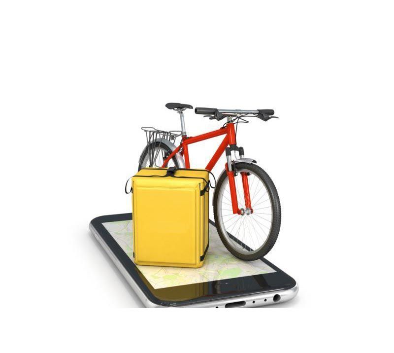 Fahrrad und Koffer, die auf einem Mobiltelefon liegen.